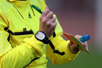 DUISBURG, GERMANY - OCTOBER 18:  A referee makes n otices on his cards during the U17 International friendly match between Germany and Netherlands at Athletic stadium Wedau on October 18, 2011 in Duisburg, Germany.  (Photo by Christof Koepsel/Bongarts/Getty Images)
